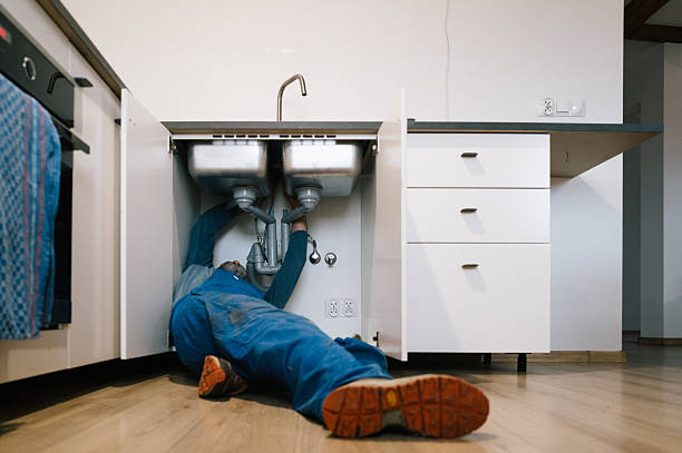 Professional Plumbing technician working in Harned, KY